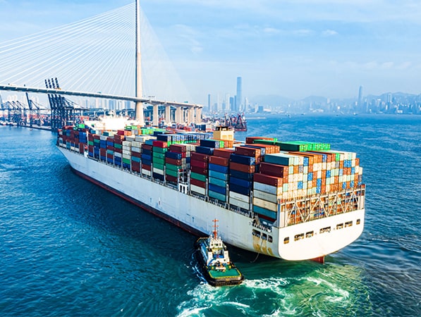 Container ship with tug